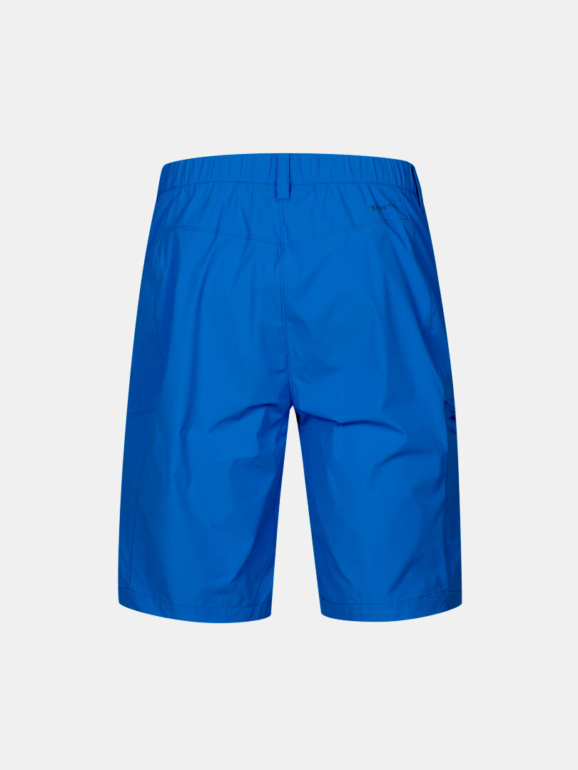 Back view of Halti Pallas Cool X-stretch Men's Shorts in bright blue with elastic waistband on a white background.