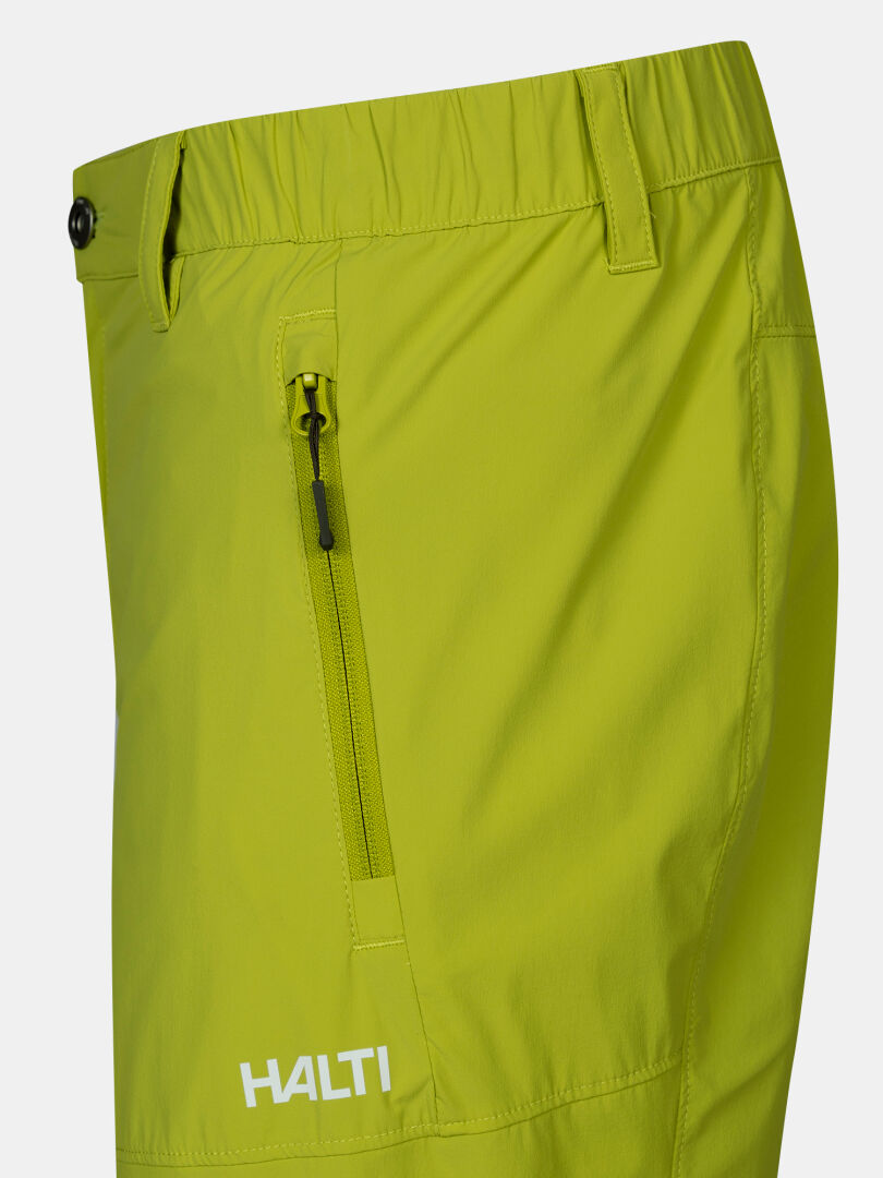Close-up of Halti Pallas Cool X-stretch Shorts Men's showing a zip pocket, logo, and quick-drying lime green fabric.