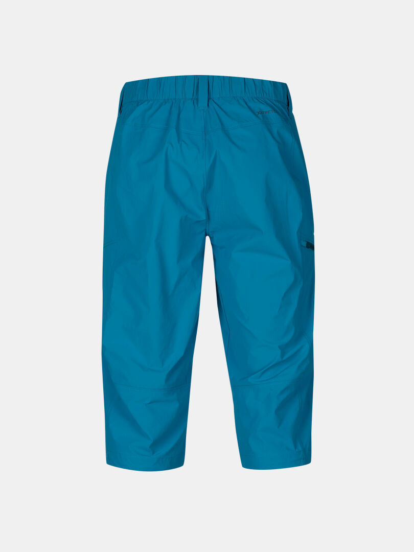 Halti Pallas Cool X-stretch mens capri pants in bright blue, UPF 90+, elastic waist, side pocket, back view on white.