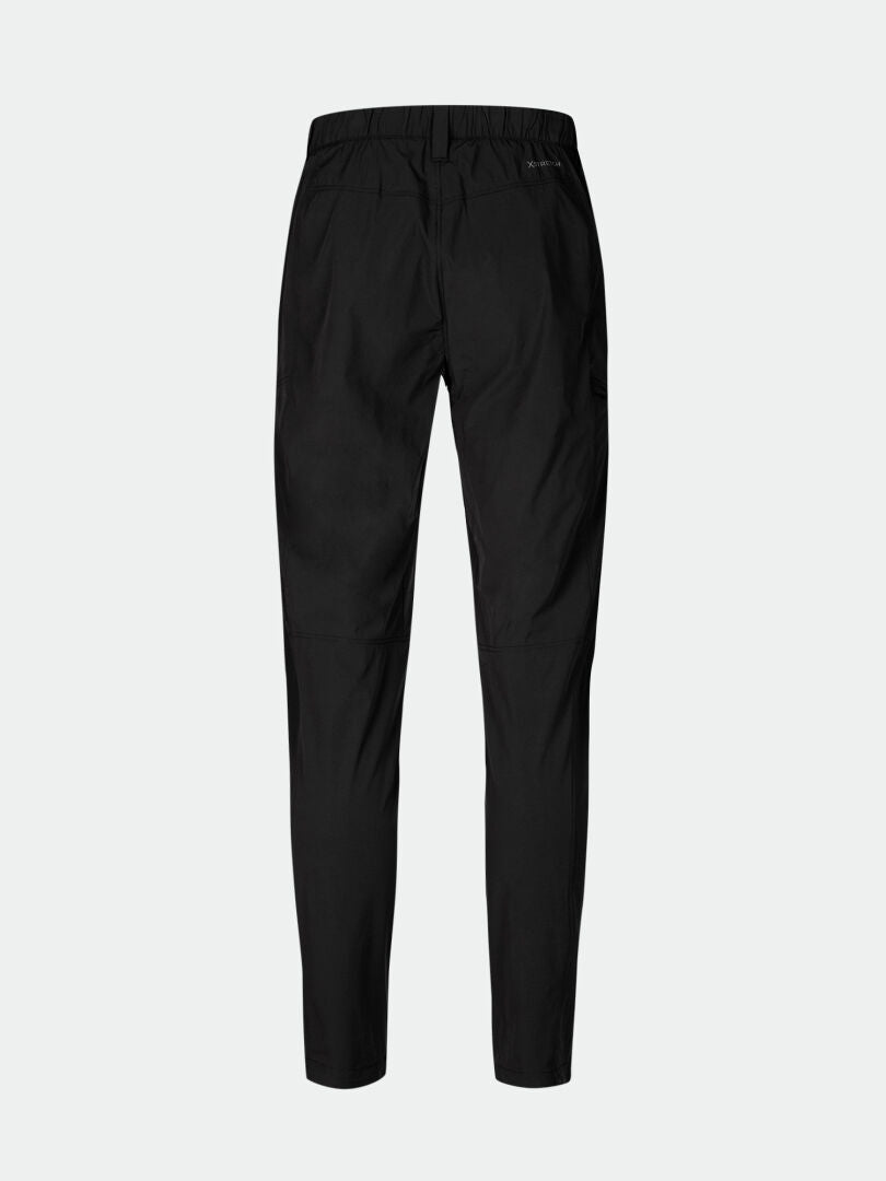 Back view of Halti Pallas Cool X-stretch Pants Mens in black with elastic waist, tapered legs, and moisture-wicking fabric.