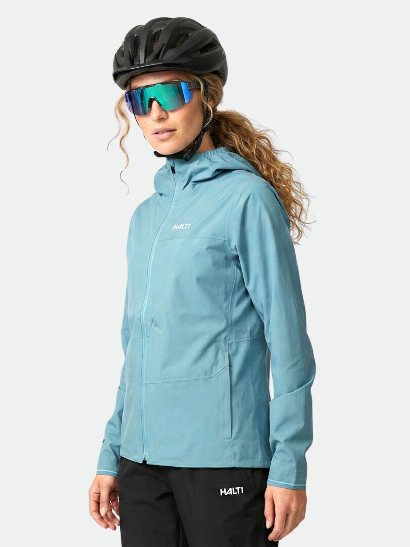 A woman wears the Halti Taival DX 3L Jacket and stands facing forward against a light background.