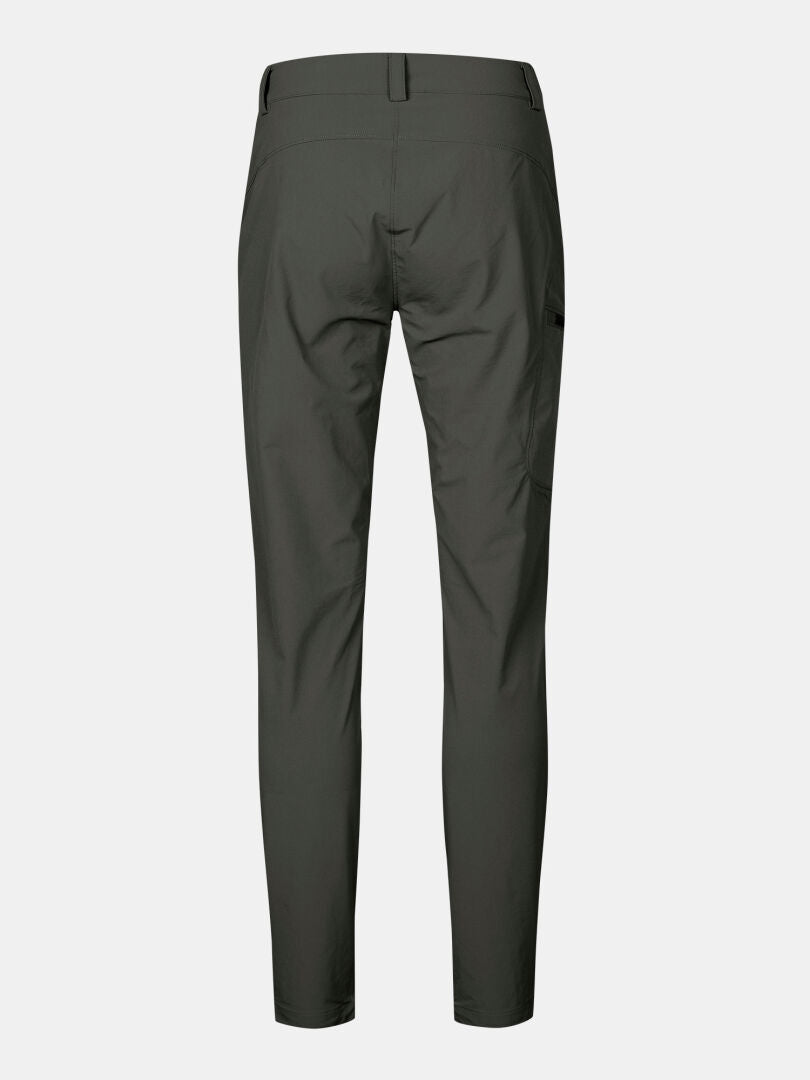 Back view of Halti Pallas X-stretch Women's dark green outdoor pants with belt loops and side pocket on white background.