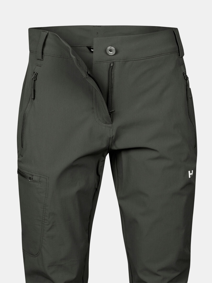 Halti Pallas X-stretch Outdoor Pants Women's Plus in dark green with zip front, snap, pockets, and logo on left thigh.