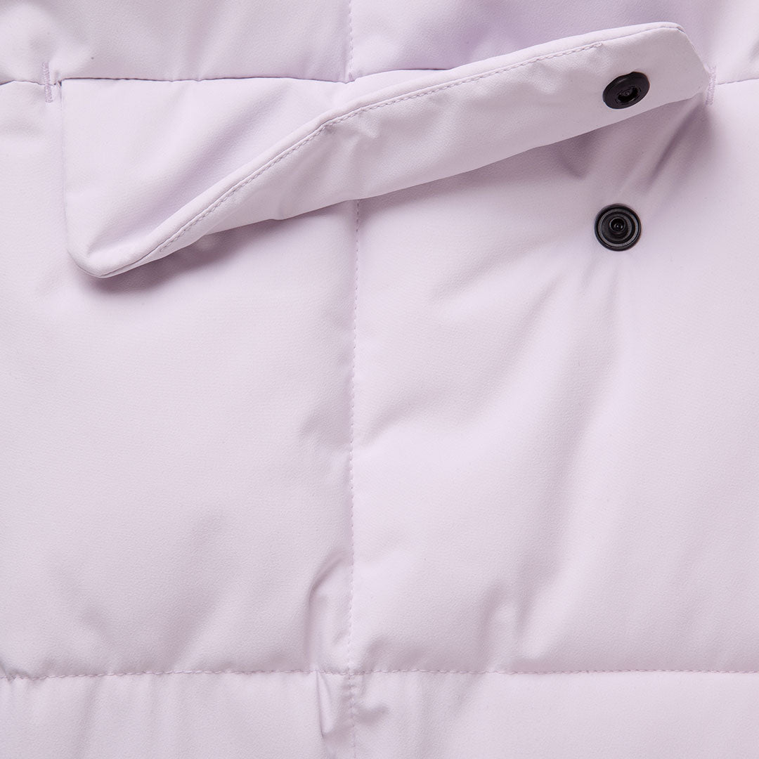 Close-up of Halti Penger Winter Jacket Womens in light purple, highlighting snap buttons and DrymaxX® stitching.