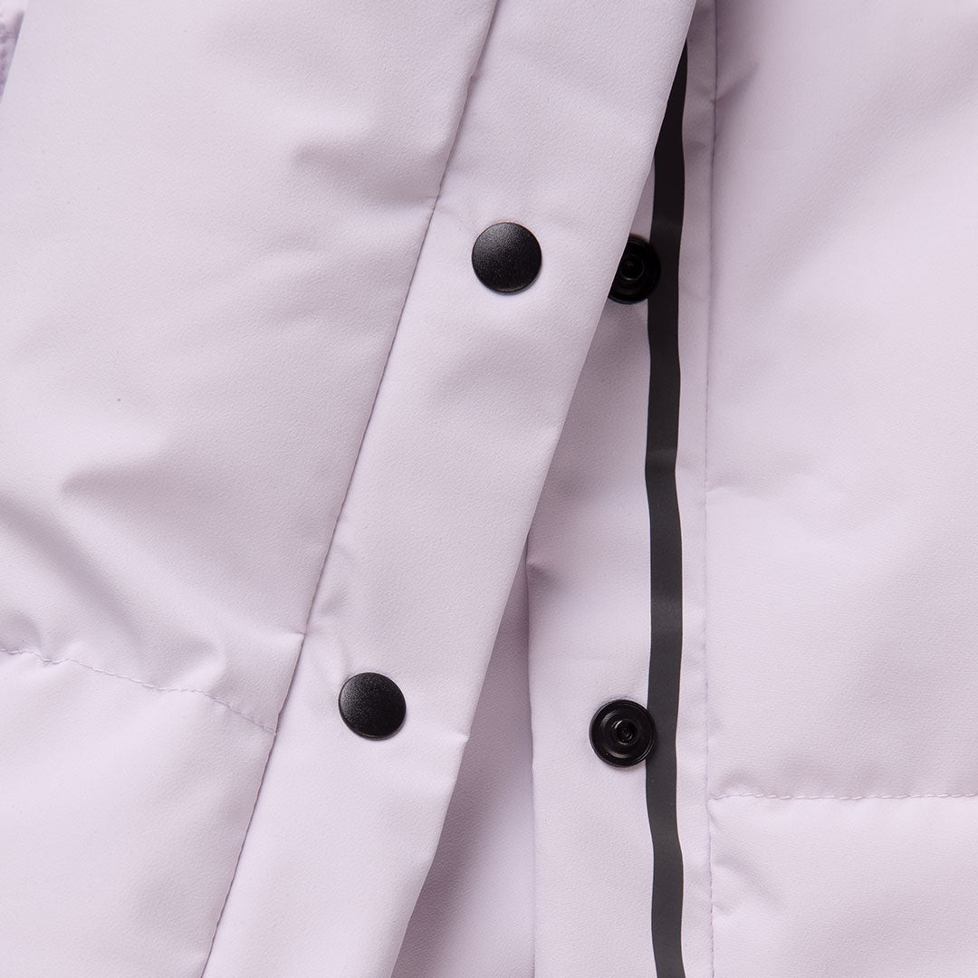 Close-up of Halti Penger Winter Jacket Womens in light purple with black snaps, zipper flap, and THERMOFILL insulation.