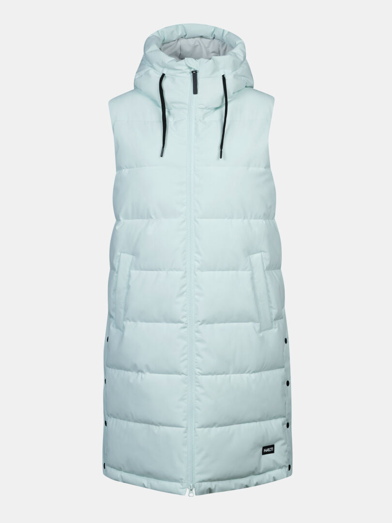 The Halti Penger Puffer Vest Women’s is a long, light blue hooded vest with windproof fabric, zipper, snaps, and pockets.