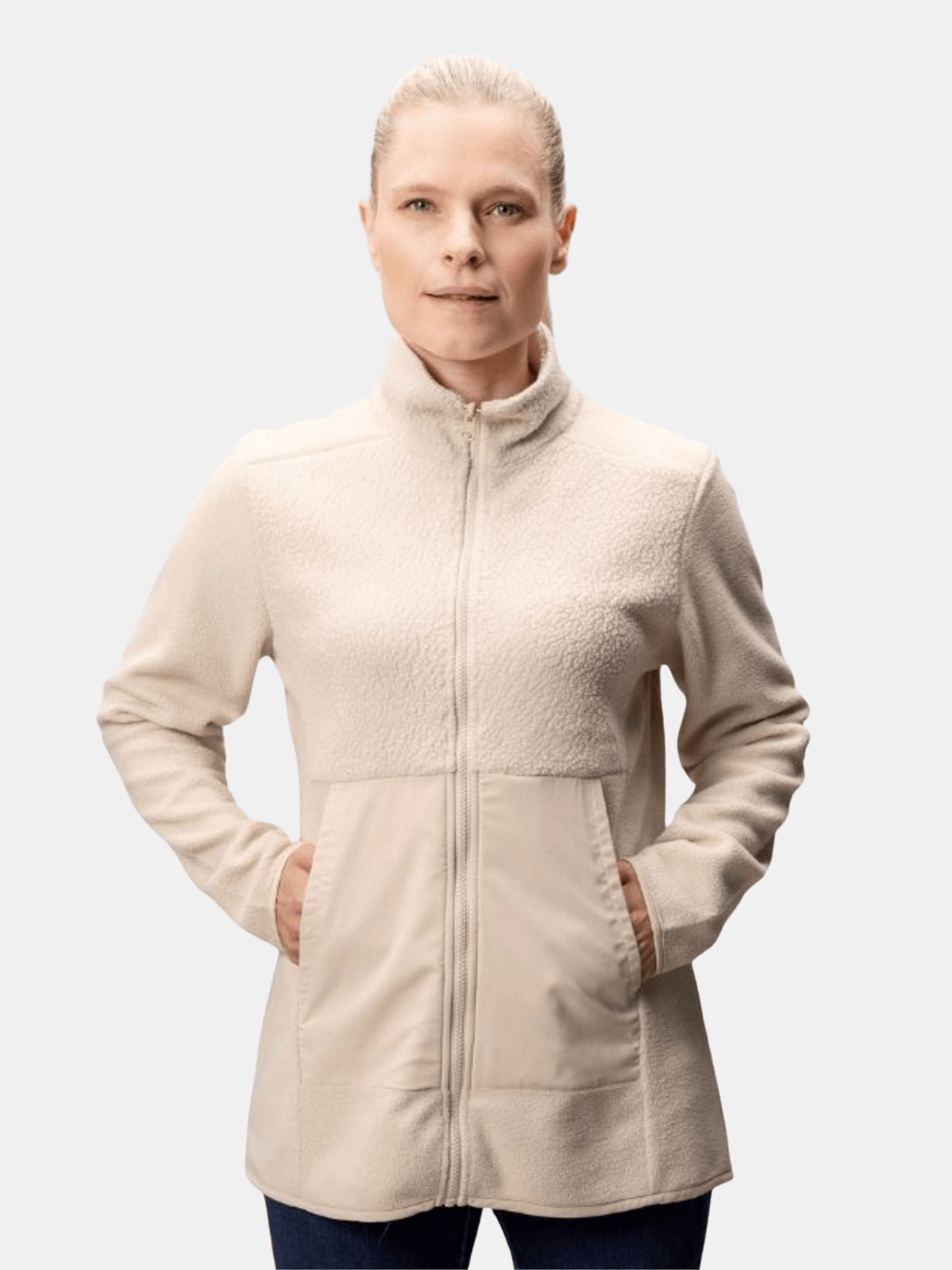 A woman wears the Halti Synkas Fleece Jacket with hands in pockets, standing against a plain background.