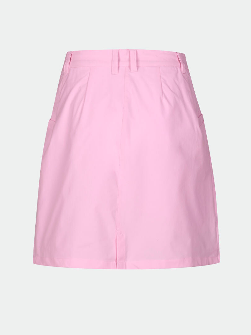 Halti Drive X-stretch Skort Womens in light pink, quick-dry with stretch, belt loops, and side pockets on white background.