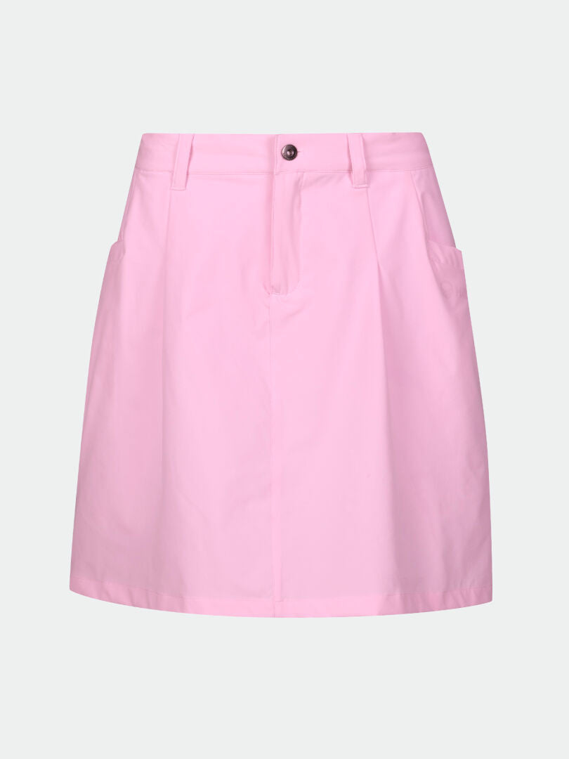 The Halti Drive X-stretch Skort Womens is light pink, knee-length, quick dry, with belt loops and side pockets.