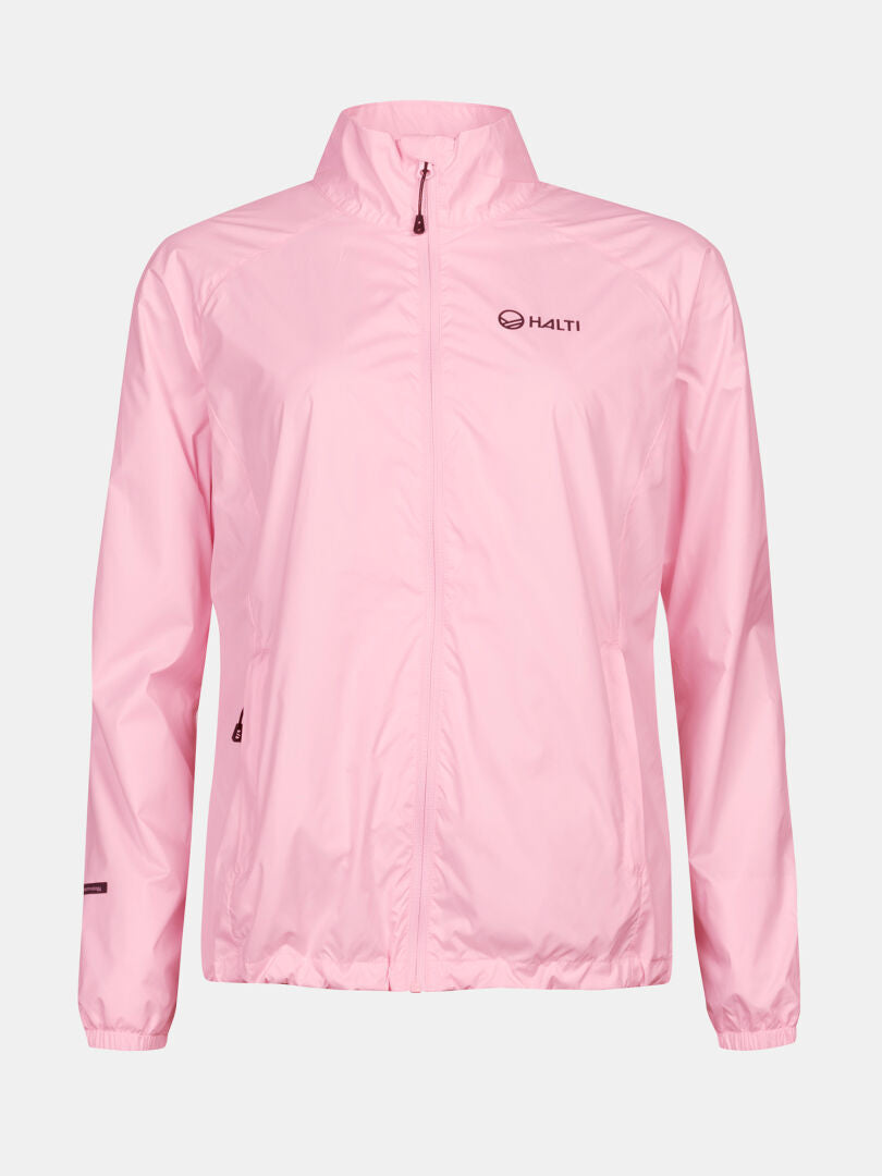 The Halti Saime Windbreaker Jacket Women's is light pink, windproof, with a high collar and Halti logo on a plain background.