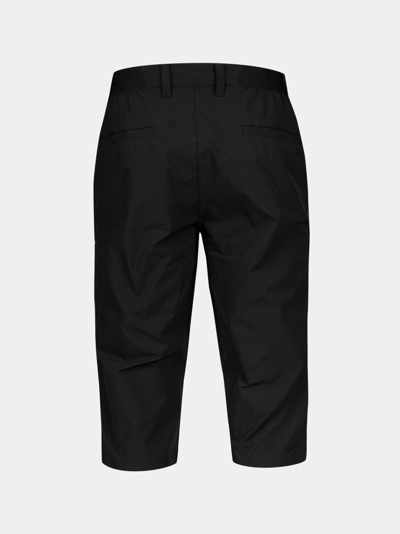 Back view of Halti Drive X-stretch men's black water-repellent capri pants, with belt loops and welt pockets.