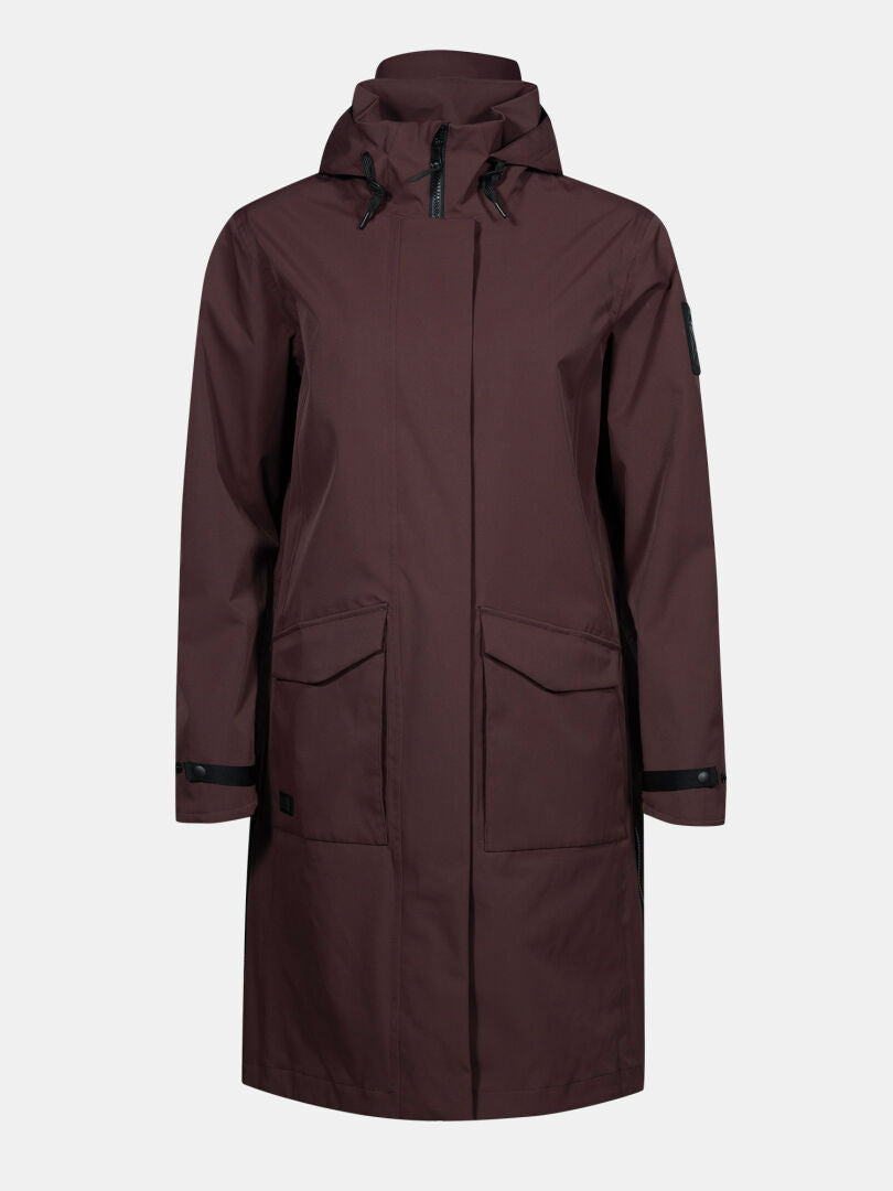 The Halti Tokoi II DX Parka Jacket Womens is a brown, waterproof shell with front flap pockets and a zipper closure.