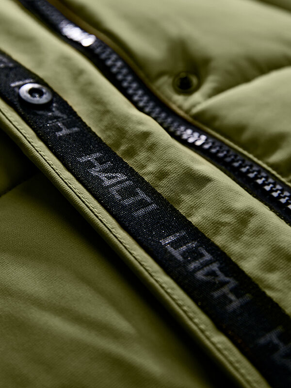 Close-up of Halti Brahe Puffer Winter Jacket Men's in green with black zipper; white text detail offers a modern touch.