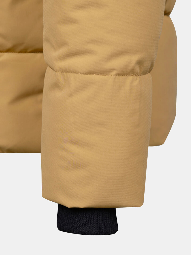Close-up of Halti Brahe Puffer Winter Jacket Men's: tan sleeve with visible stitching and black ribbed cuff.