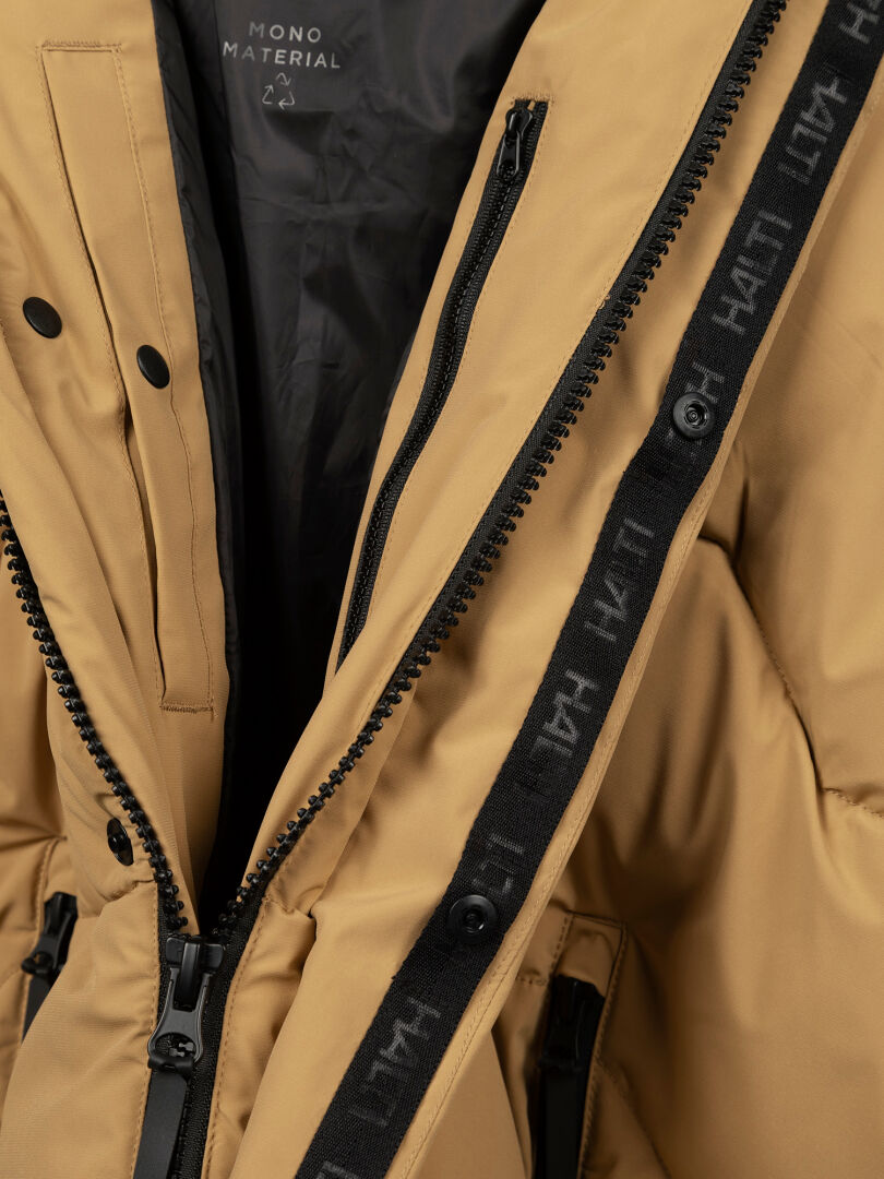 Close-up of the Halti Brahe Puffer Winter Jacket Men's with black zippers, branded tape, insulated interior, and label.