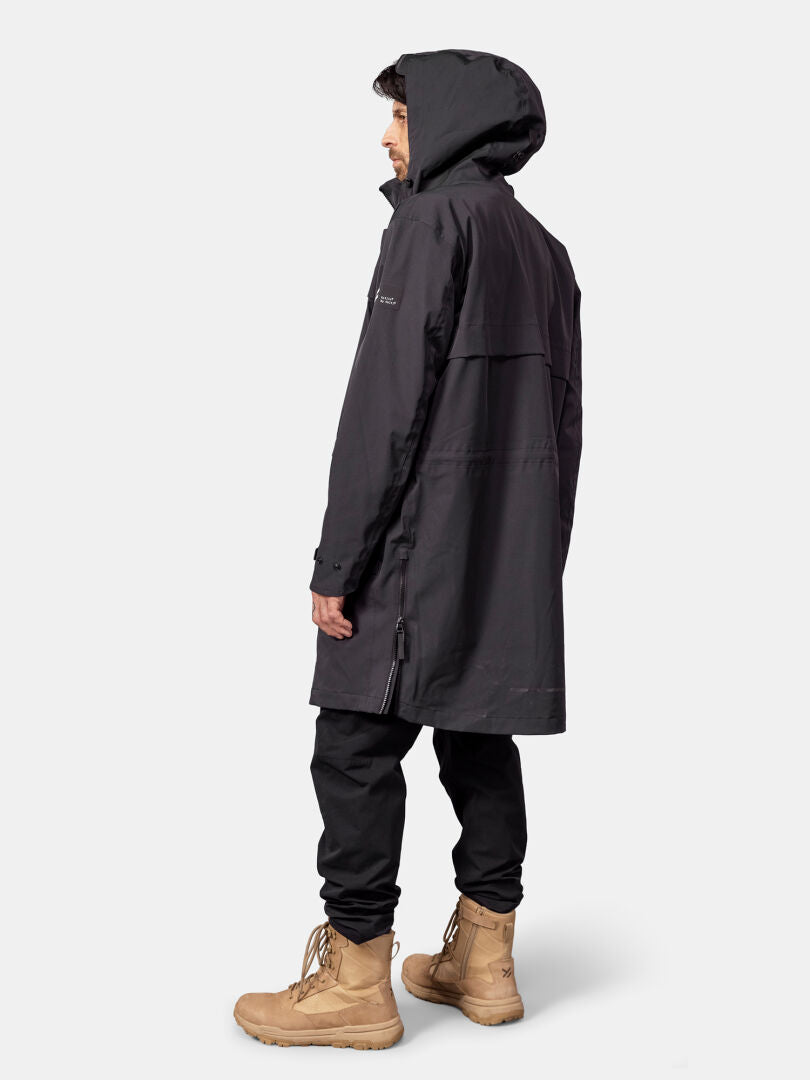 Person wearing a Halti Tokoi II DX Parka Jacket, black pants, and tan boots, standing and facing left.