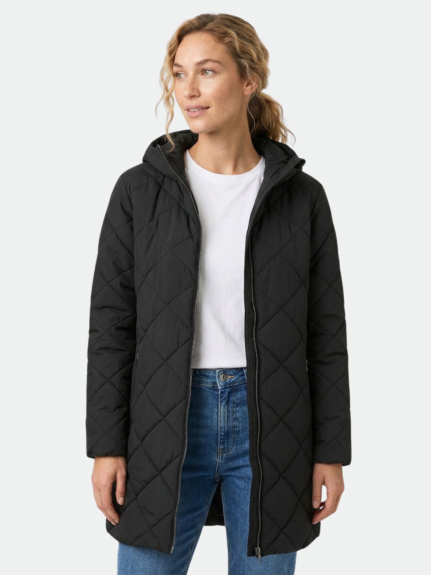 Wearing the Halti Haapa Quilted Coat Jacket, white tee, and blue jeans against a light background.