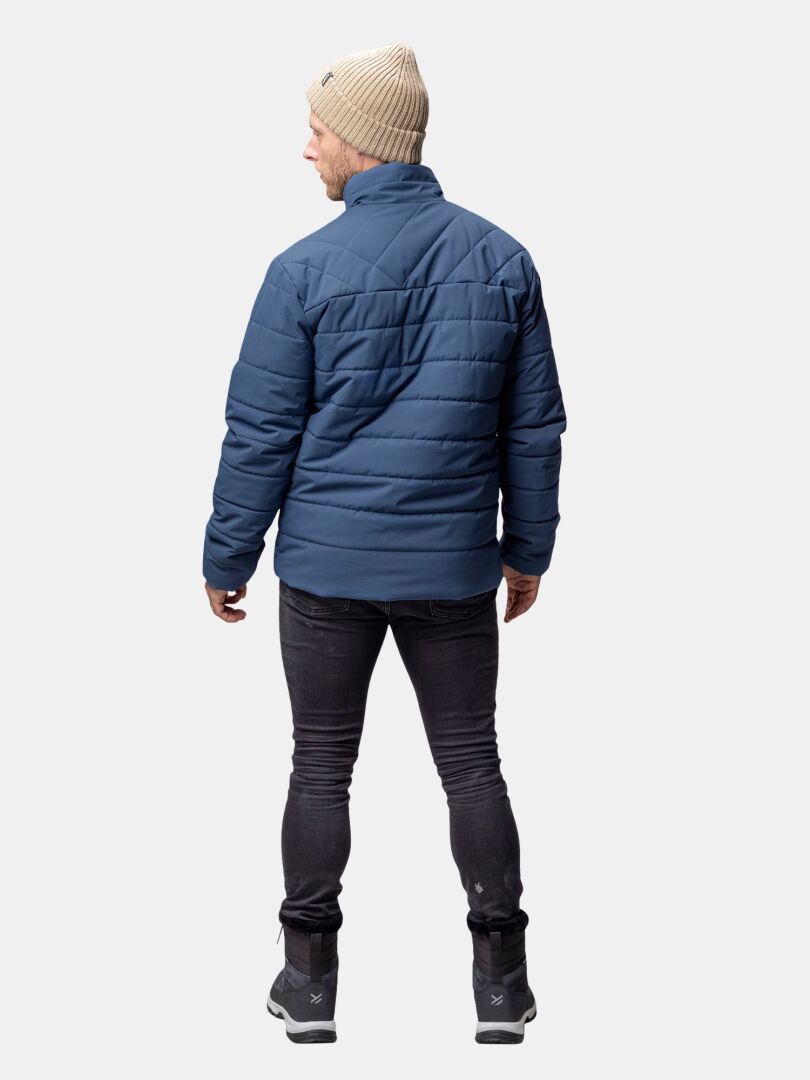 A person wearing the Halti Haapa Insulated Jacket Men's stands facing away in black jeans, gray boots, and a beige hat.