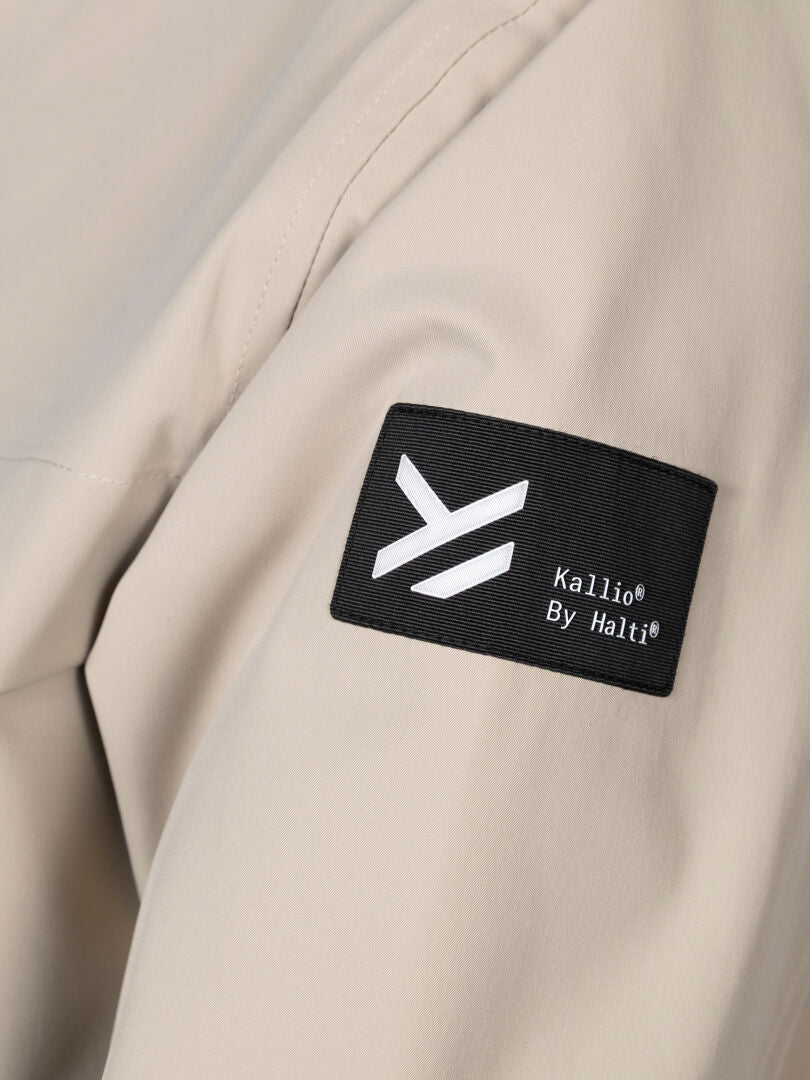 Close-up of beige DrymaxX 2-layer fabric on the Tokoi DX Jacket Men's, with a black Halti patch label.