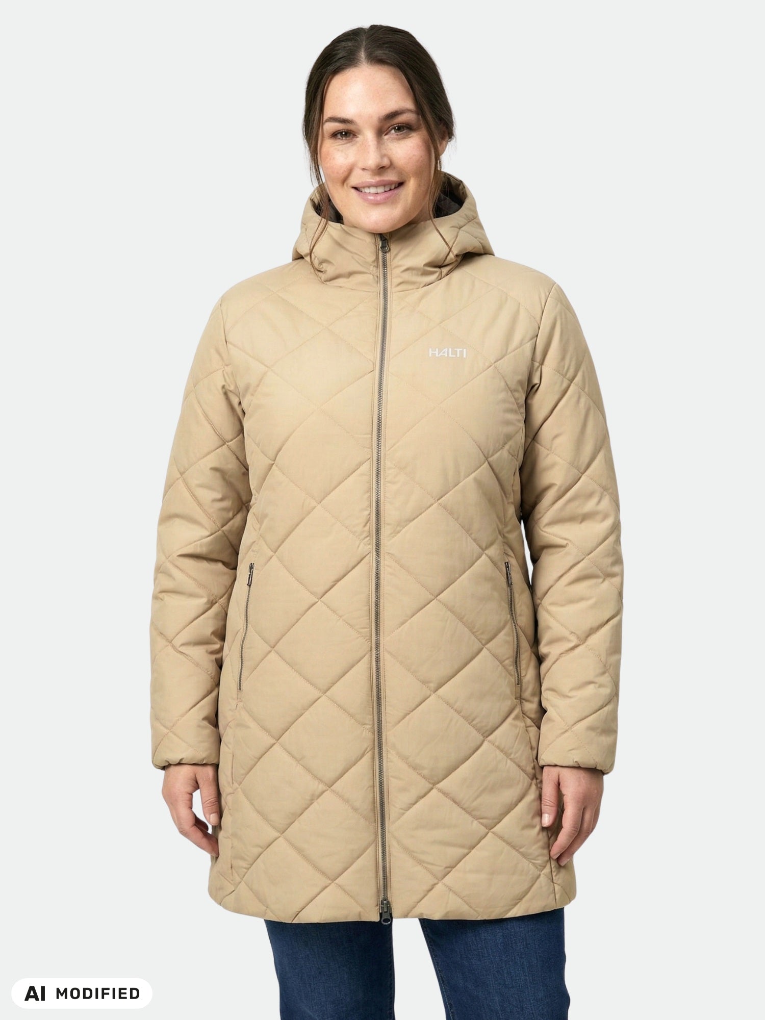 A woman wearing the Halti Haapa Quilted Coat Jacket Women's Plus in beige smiles at the camera with hands by her sides.