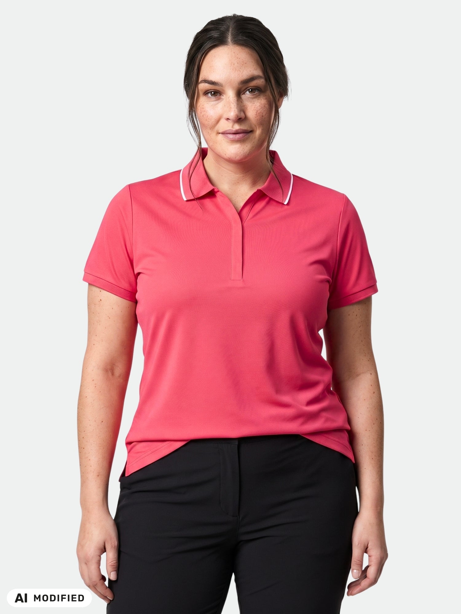 A woman wears the Halti Swingi Technical Polo Shirt Women's Plus in pink with black pants, ideal for summer activewear.