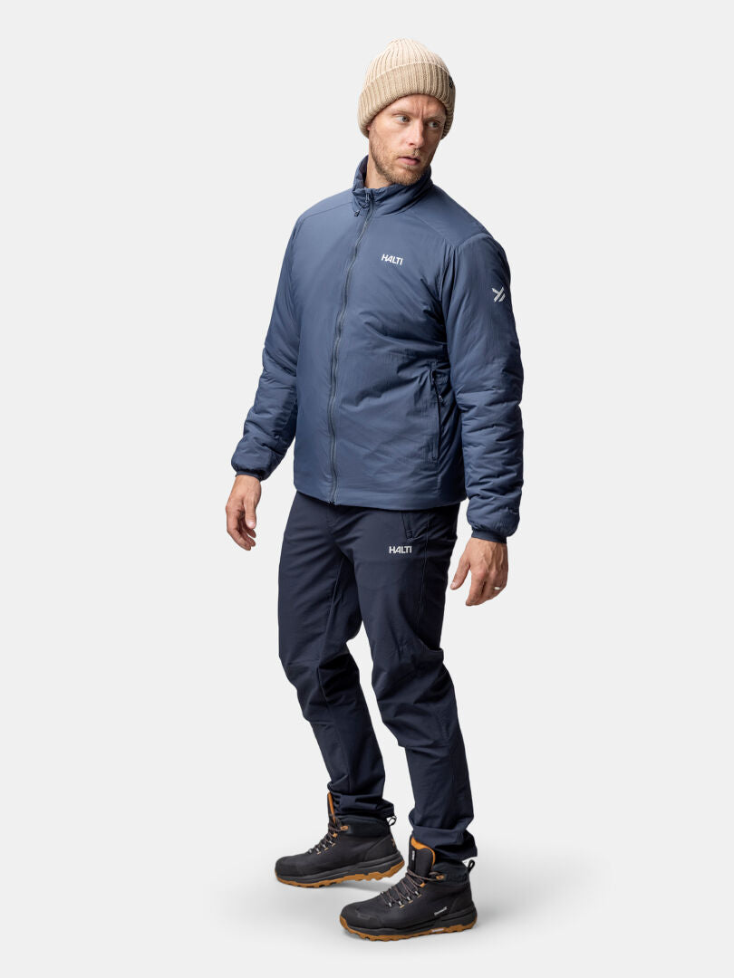 A man in a beige beanie wears the Halti Haave Insulation PrimaLoft Jacket, facing left.