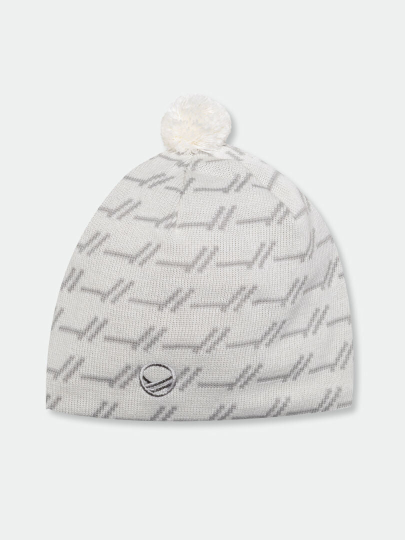 Halti Ramsau Beanie: white wool blend with gray geometric pattern, white pom-pom, and front logo patch.