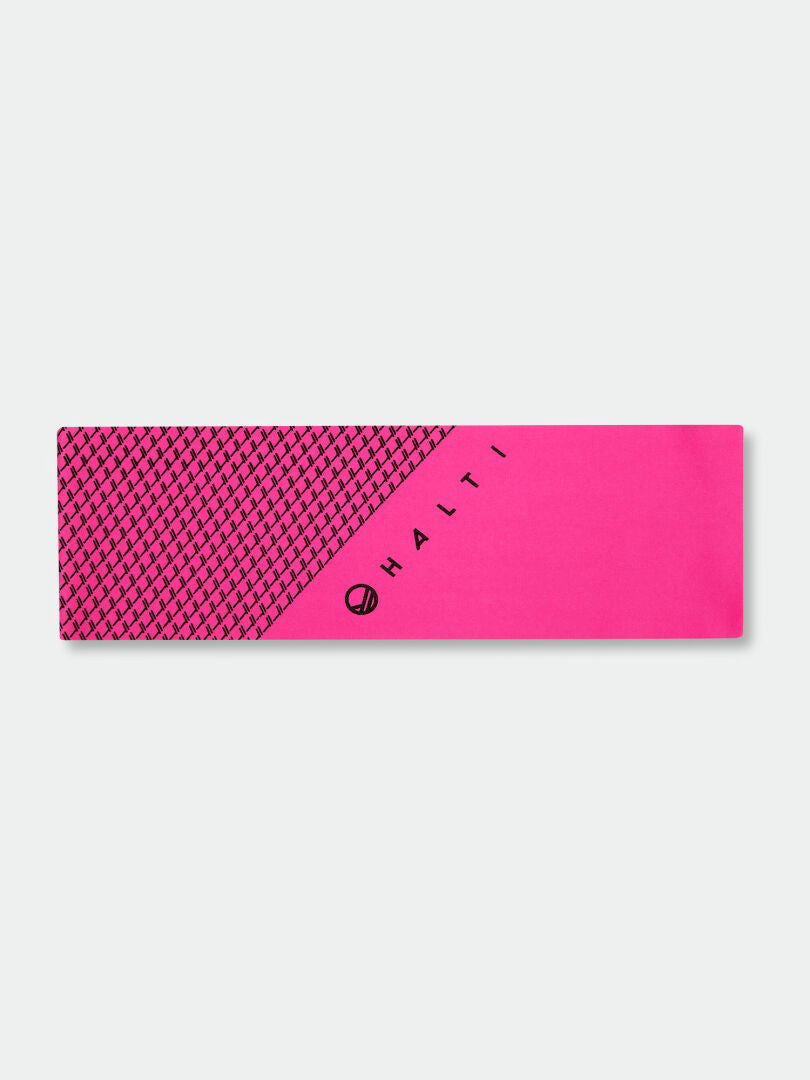 The Halti Suunta Band is a pink headband with a black geometric pattern and reflective print—ideal for outdoor activity.