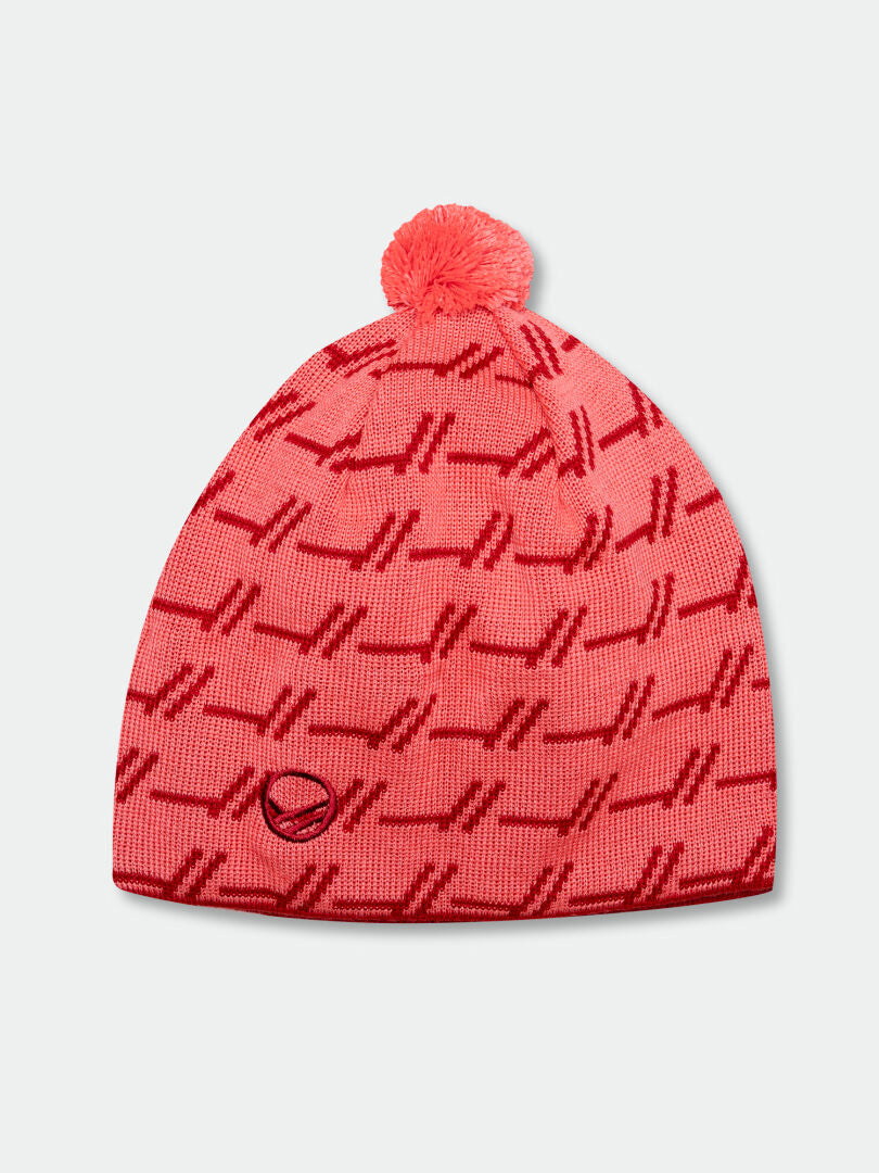The Halti Ramsau II Merino Beanie is pink with a red pattern, pom-pom, and small circular logo by the brim.