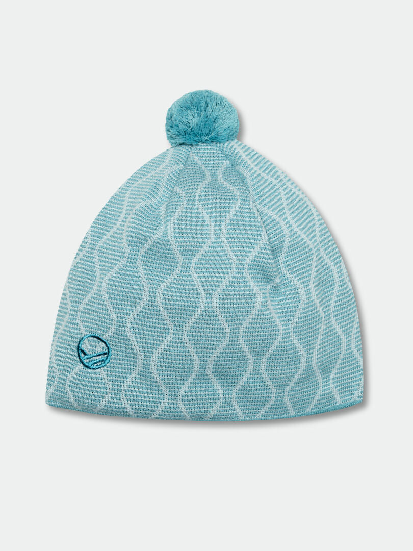 Halti Mutka Beanie: light blue Merino wool knit with wavy pattern, pom-pom, and small round logo near the edge.