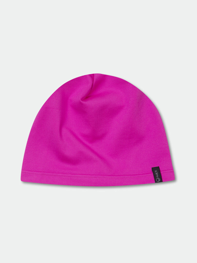 The Halti Loiva Beanie is a bright pink recycled knit with a black tag, shown on a light gray background.