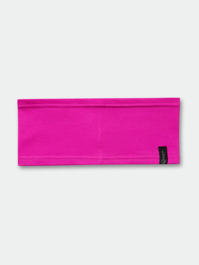 The Halti Loiva Headband is flat, bright pink, breathable, and moisture-wicking with a small black tag.