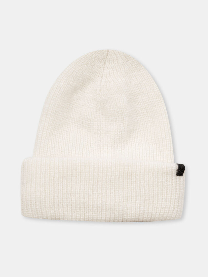 The Halti Vuolle Mohair Beanie is white merino with a folded brim and a small black tag on the right side.