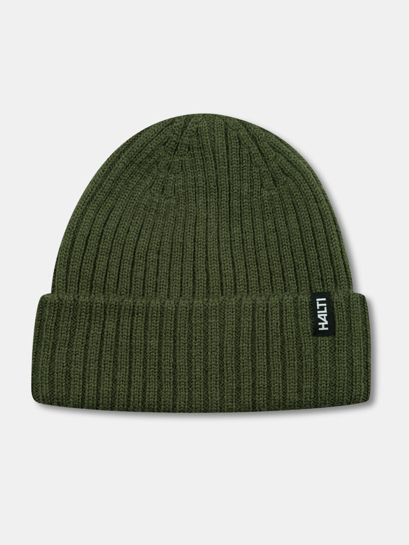 Halti Runko Beanie: olive green, rib-knit, folded cuff, and a small black-and-white Halti logo tag.