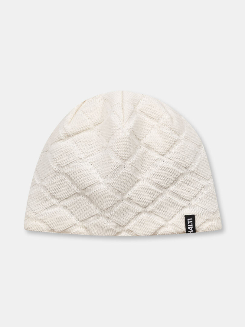 The Halti Crostie Merino Beanie is a white, diamond-patterned hat with black tag, ideal for cross country skiing.