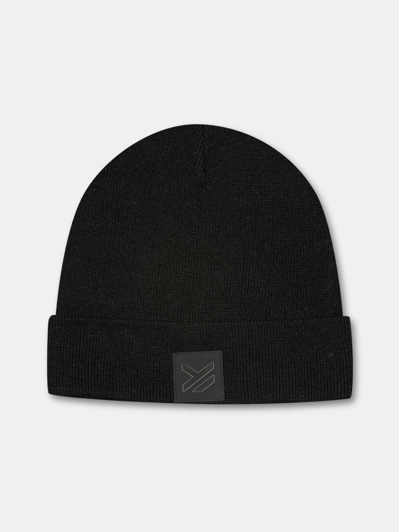 The Halti Vataja Beanie is a black knit beanie made from recycled polyester with a folded brim and front logo patch.