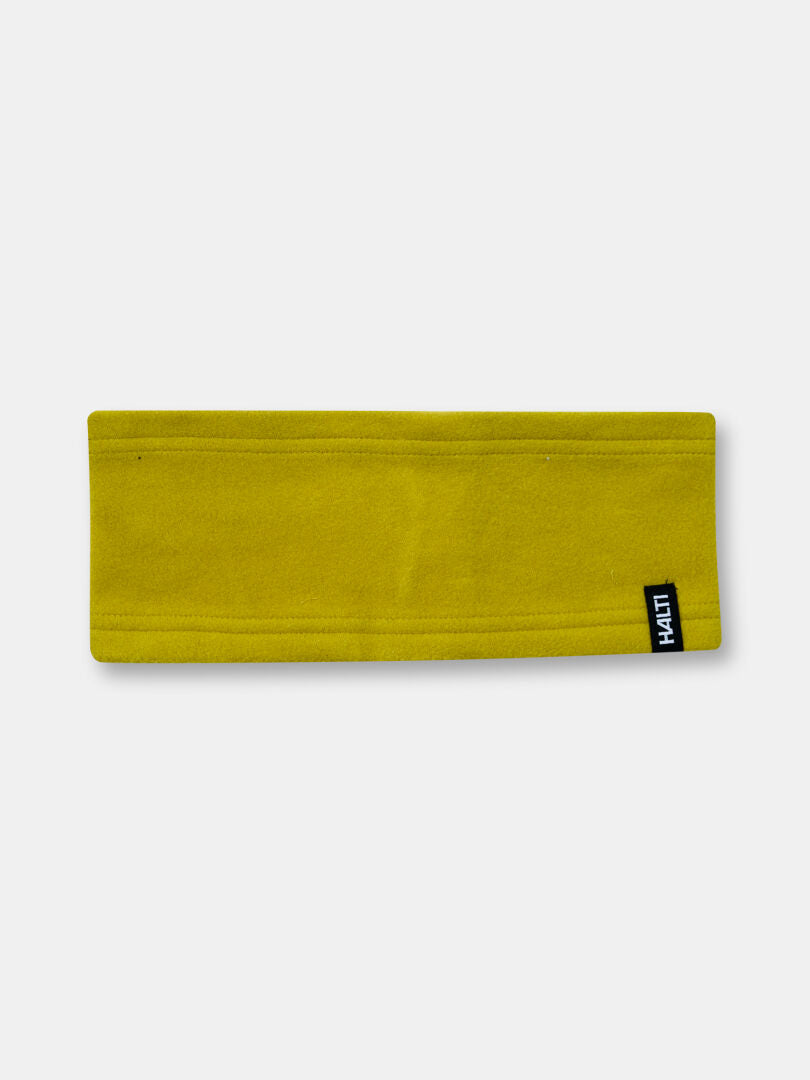 The Halti Trone Fleece Headband in yellow features thermal insulation and a black-and-white tag, shown on white.