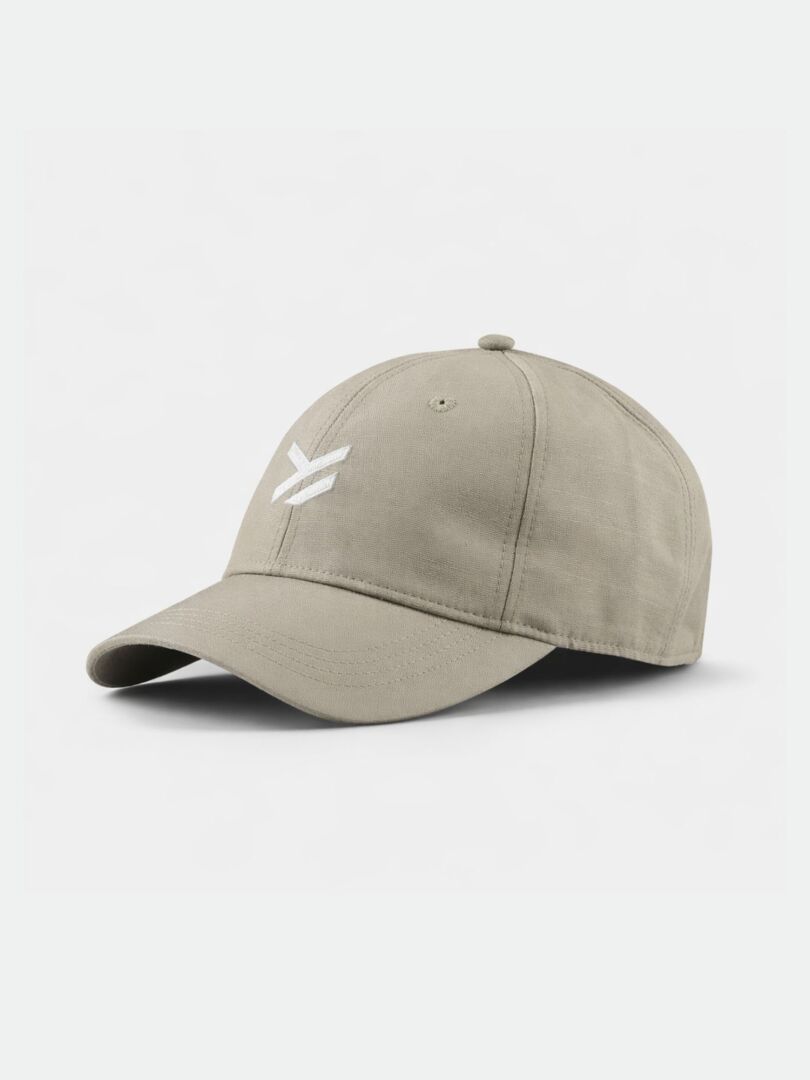 The Halti Notsgi Cap is beige, low-profile, with a white embroidered logo on the front, shown on a white background.