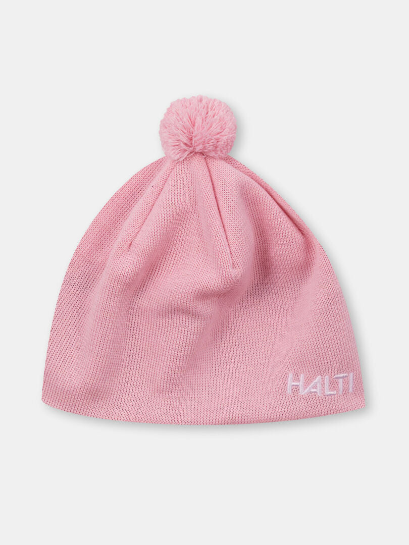 The Peesi II Beanie by Halti is a pink wool-blend winter hat with a pom-pom and white side logo.