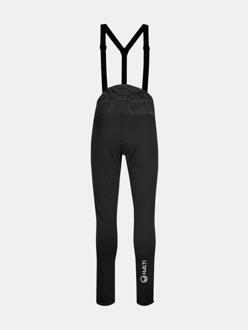 Halti Siide XC Set Women's—black, high-waist softshell bib pants with suspenders, KALTI logo by left ankle, back view.