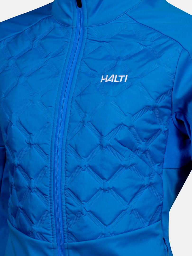 Close-up of Halti Framover Hybrid XCT Jacket Women's in blue with quilted diamond front and visible zipper.