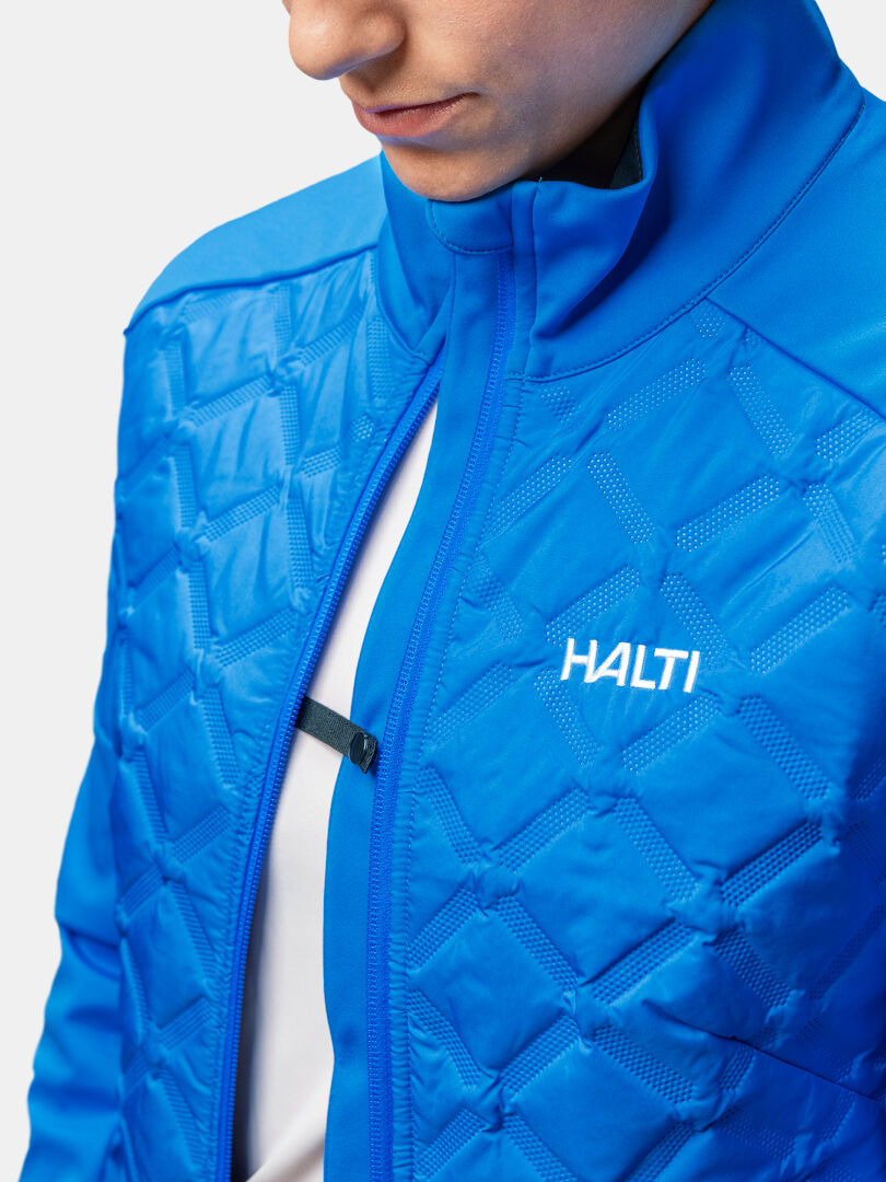 Person wearing a Halti Framover Hybrid XCT Jacket Women's, ideal for active multisport adventures.