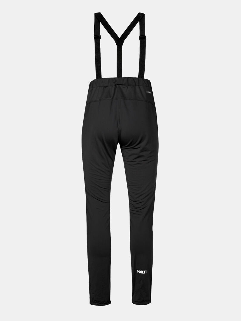 Halti Huuru XC Set Women's Plus black pants with suspenders, HULT logo by the left ankle, for cross-country skiing.