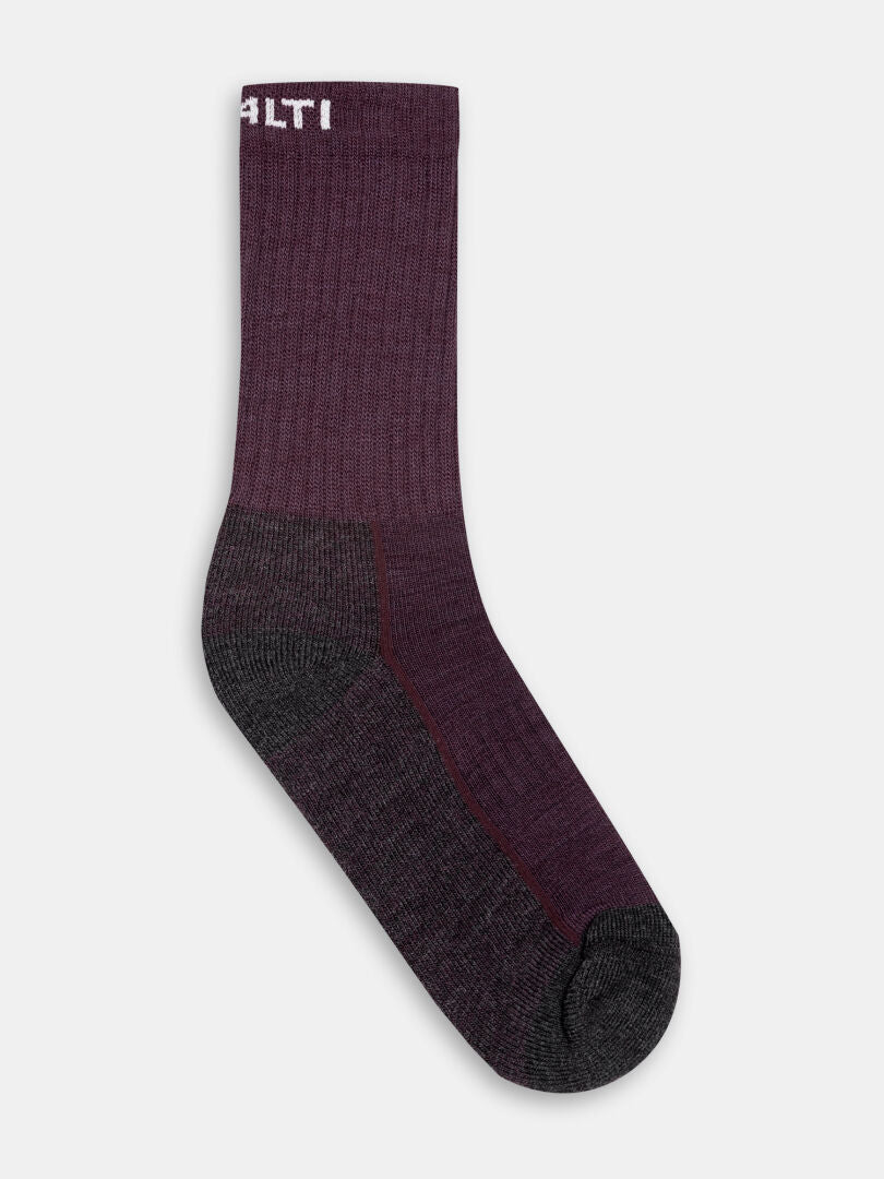 A single Halti Trekking Warm Merino Sock in maroon/dark gray with ribbed texture and white text on plain background.