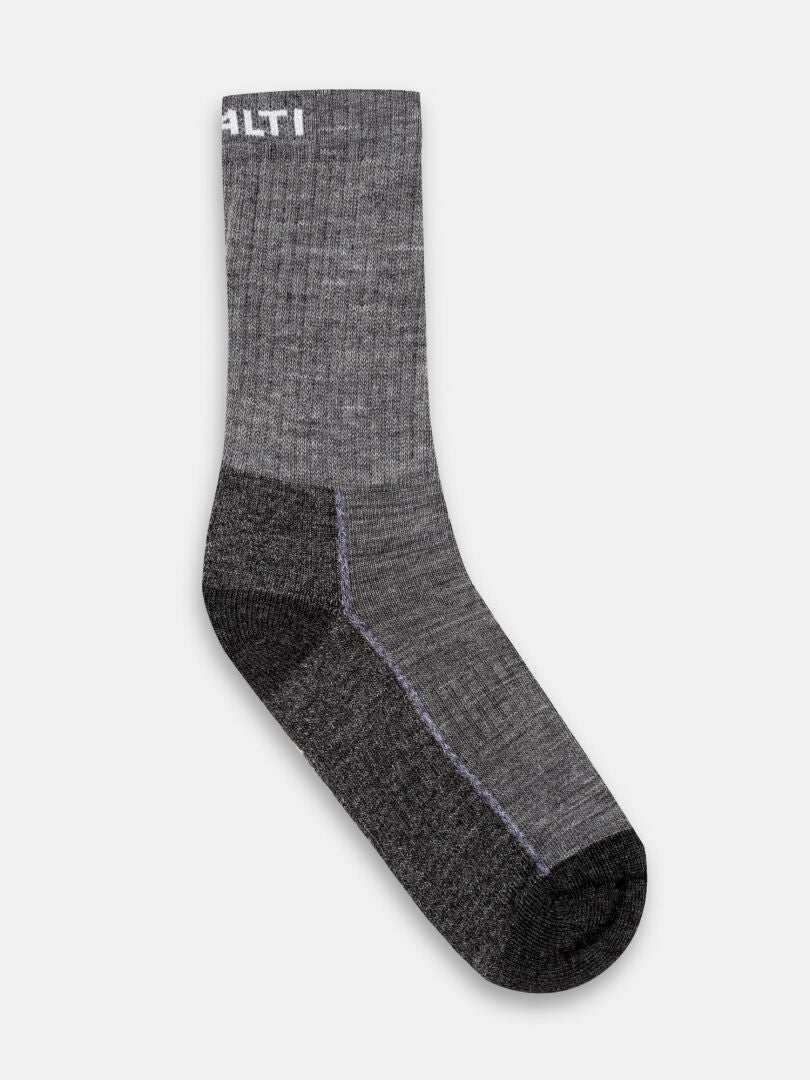 A single gray Halti Trekking Warm Merino Sock, mid-calf with dark heel/toe and partially visible white text at cuff.