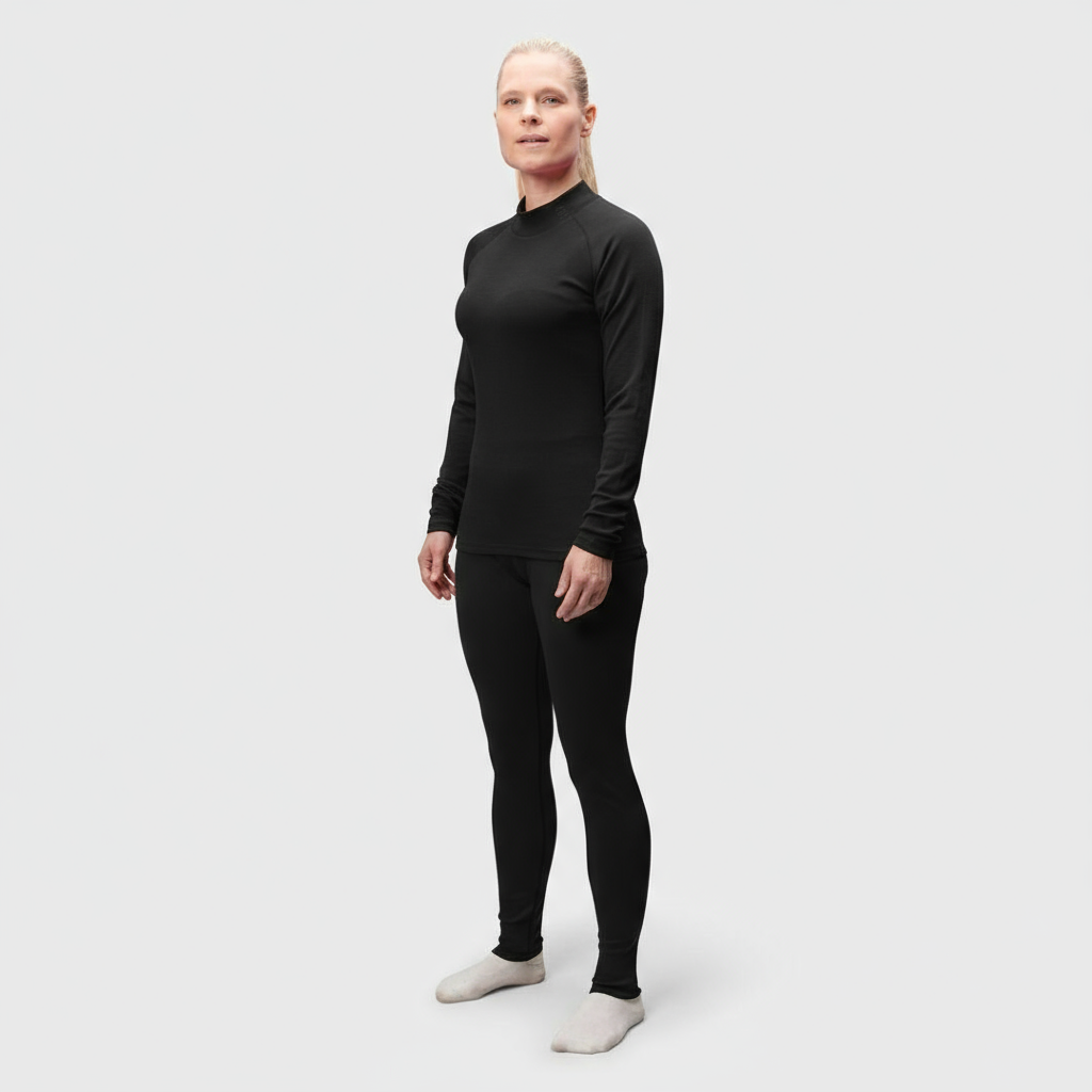 A person wears the Halti Neva Merino Base Layer Set Women's, facing forward in breathable outdoor clothing.
