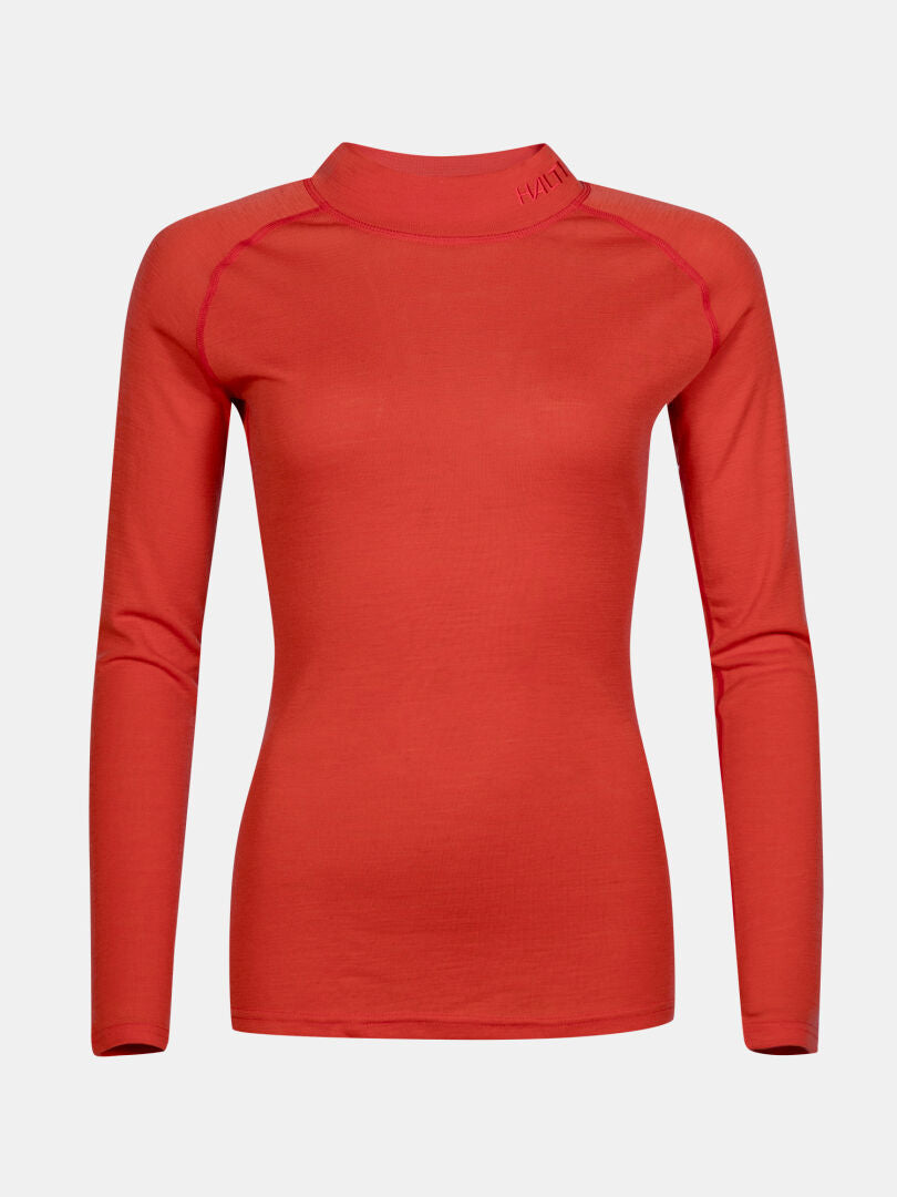 The Halti Neva Merino Base Layer Set Women's is a fitted, long-sleeve red top with a high neck for outdoor wear.