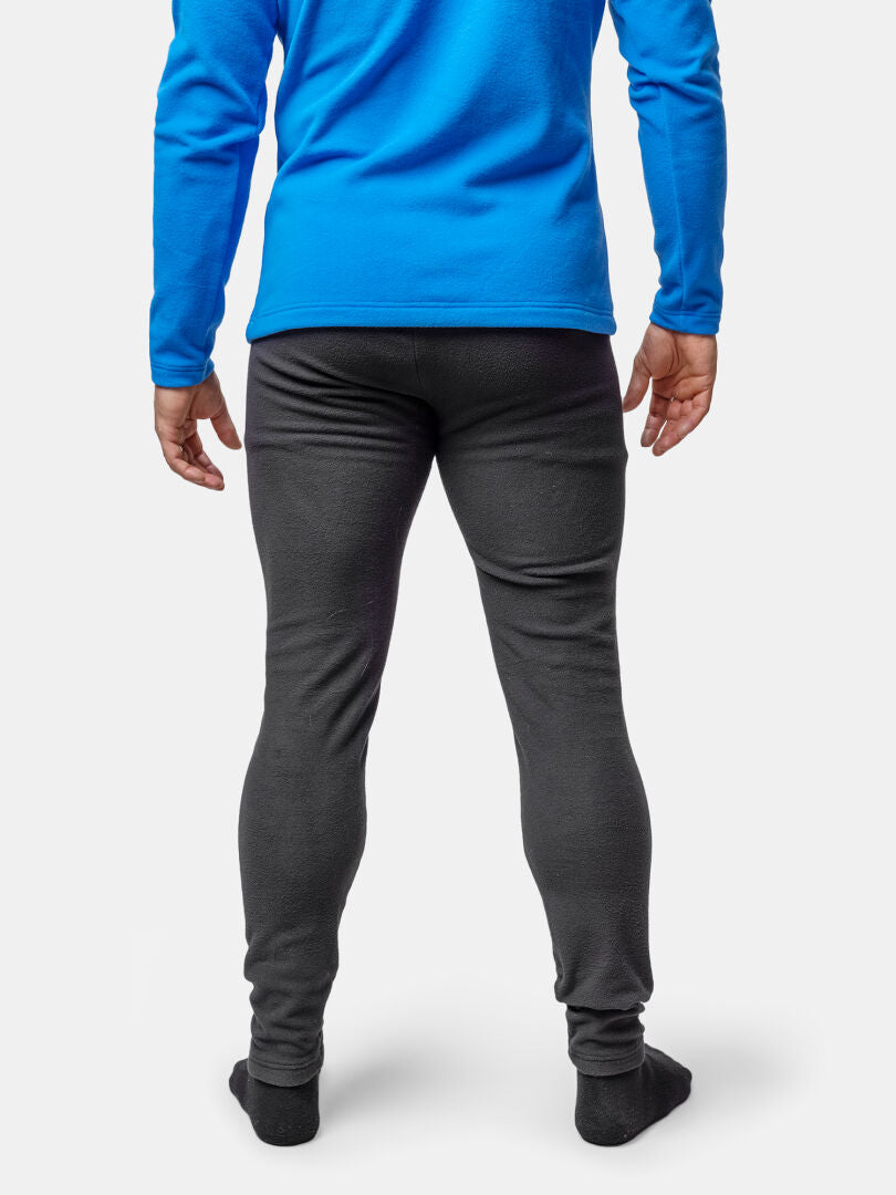 A person wearing Halti Trone Fleece Pants and a blue long-sleeve shirt stands with their back to the camera.