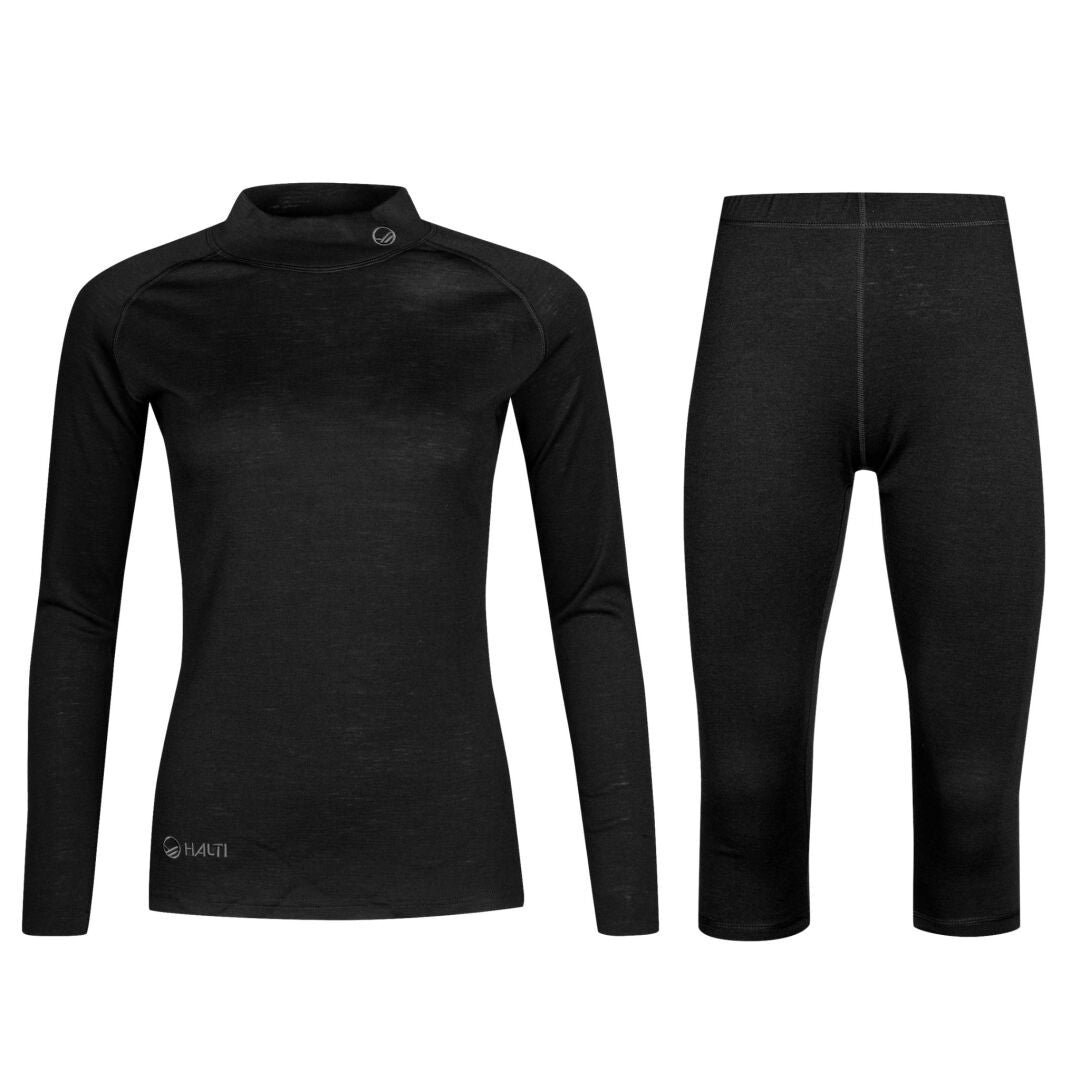 The Halti Neva Merino 3/4 Base Layer Set Womens in black features a long-sleeve top and leggings on white.