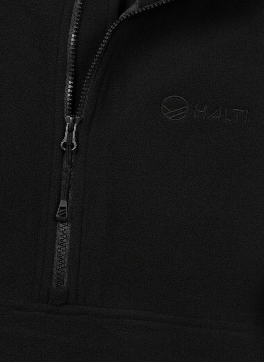 Close-up of Haltis Ossia Half Zip Fleece Shirt Womens in black, ideal for outdoor adventures.